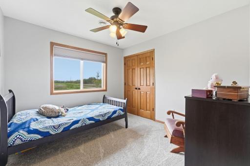 Sun-drenched mornings await in this bright, east-facing second bedroom.