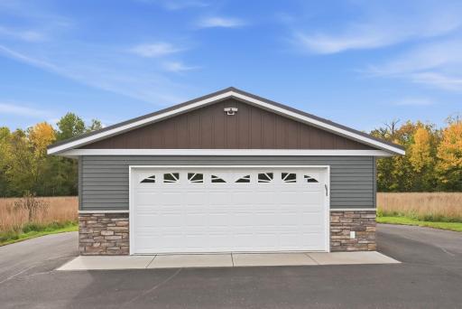 Detached 2 car garage. Steel siding with brick accents and steel roofing protect this home and detached garage.