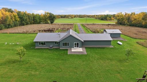 Pristine rock landscaping and a raised cement patio. Enjoy premium outdoor living with none of the maintenance, staining, or under-deck cleanup required by traditional wood decks.