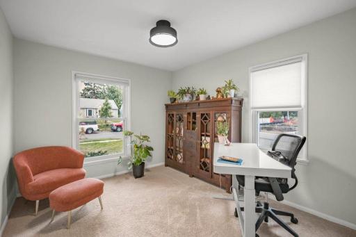 This main-floor bedroom is currently used as a home office, offering a bright, flexible space for work, guests, or whatever fits your lifestyle best.