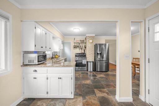 Cabinetry and counter space keeps everything organized, while the open layout makes it easy to move between cooking, dining, and gathering.