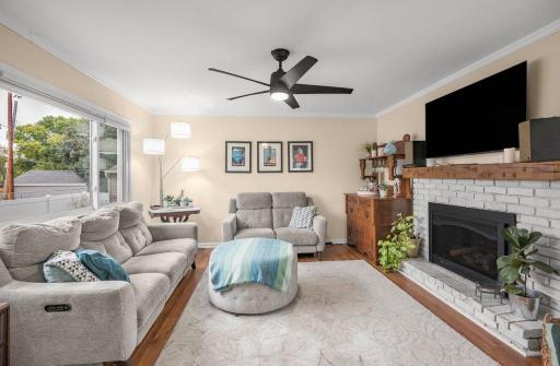 The oversized window fills the family room with natural light and brings the outdoors in, making this already spacious room feel even brighter, warmer, and more inviting.