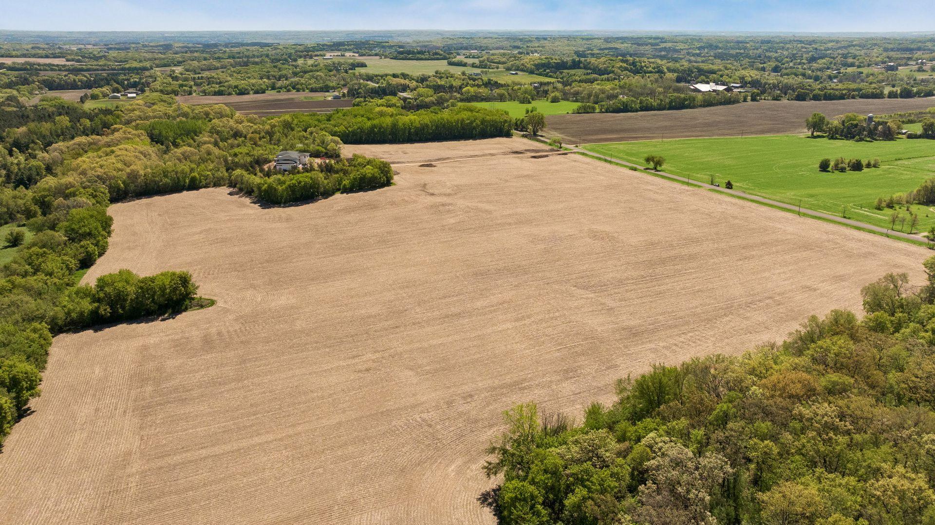 Whether you envision a stately custom estate, a modern farmhouse, or a private retreat tucked among the trees, this extraordinary property offers the space and setting to bring your vision to life.