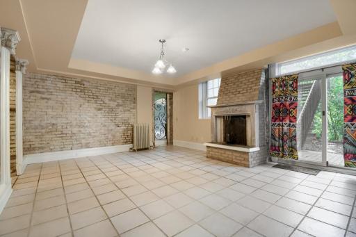 Living room with wood burning fireplace and patio access