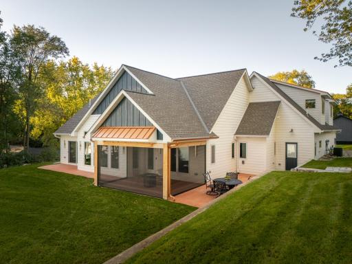 This custom designed architectural masterpiece where contemporary luxury perfectly intertwines with classic craftsman charm. *Cooper accents make this porch a one of a kind.