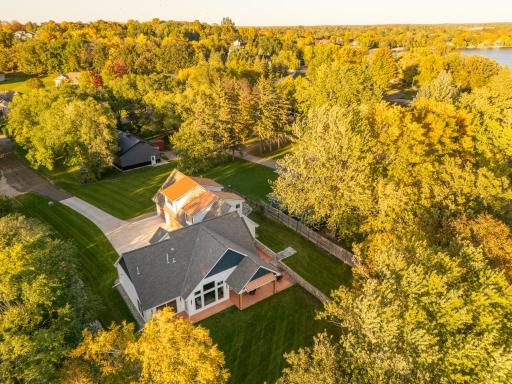 Custom designed lake home is surrounded by mature trees on a .59 Acre lot.