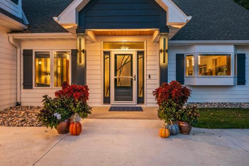 Beautifully designed front entrance radiates curb appeal and showcases exceptional craftsmanship and meticulous ownership.