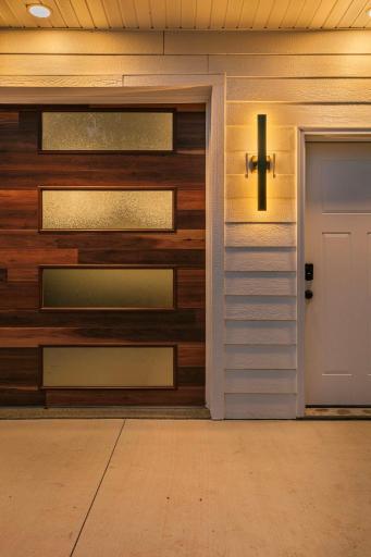 Close up of garage door privacy windows and night lighting.