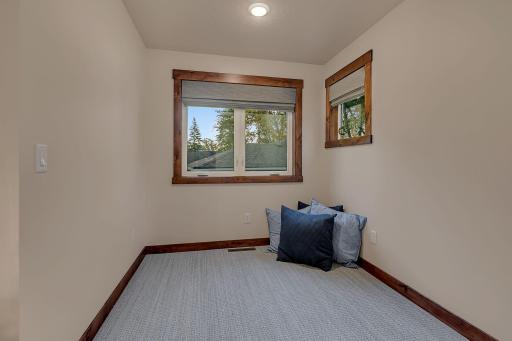 The L-shape to the family room-nook, space for a futon, desk, fooseball, exercise equipment, buyers choice.