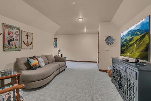 Inviting bonus room has a versatile-L-shape family room offering the perfect private secondary living space complete with modern LED lighting.