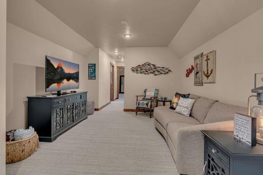 Top quality carpeting! Second picture of the spacious comfortable family room, picture leading to the bedrooms and full bath.