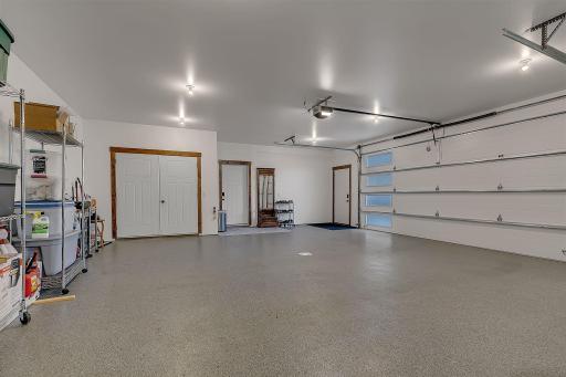 Apoxy floor, double door closet for softener salt service, on-demand hot water heater, storage space.