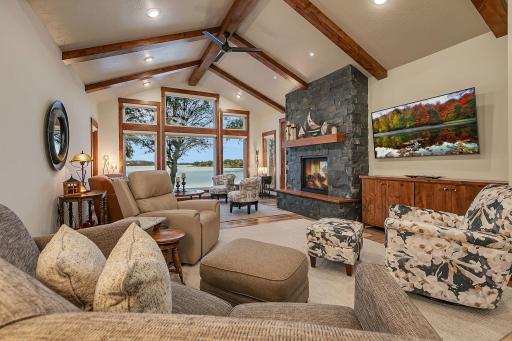 Custom hand stamped ceiling, Alder beams, 12FT peak, lakefront viewing.