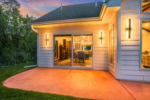Indoor-outdoor flow-Expansive glass sliding doors seamlessly bridge the interior living and dining spaces with spacious outdoor patio.