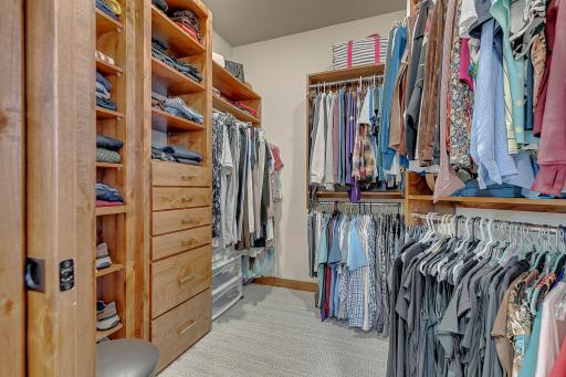 Spacious and professionally organized floor to ceiling custom walk-in closet for maxium storage.