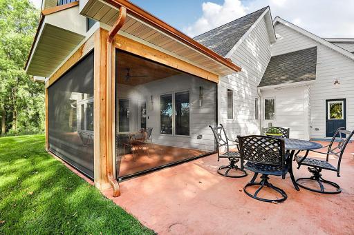 The Screen operated remote turns this porch-patio into an outdoor living oasis.