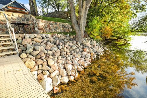Riprap shoreline to protect the soil from erosion, clear, clear water!