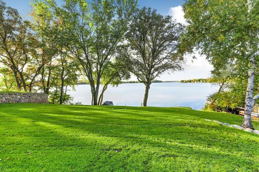 With the lush green lawn rolling gently towards the water provides space for endless lakefront memories. Buyers will fall in love with the peaceful lifestyle this exceptional lakeside home offers!