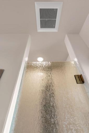 Rain-glass shower door with full swing for easy access.