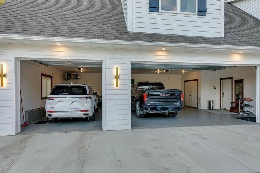 Dream garage! This space effortlessly accommodates large trucks, SUV's and luxury vehicles.