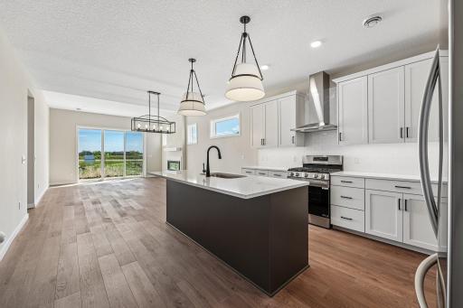Kitchen. Welcome to the Eveleth Patio plan by Robert Thomas Homes. Photos are of similar home; options and features will vary.