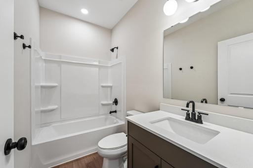 Main Level Bathroom. Welcome to the Eveleth Patio plan by Robert Thomas Homes. Photos are of similar home; options and features will vary.