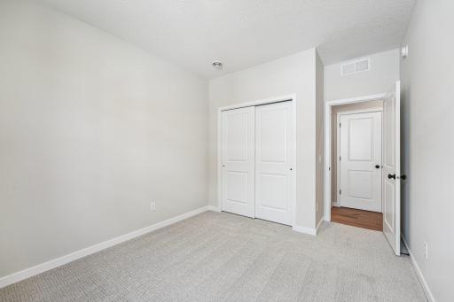 Bedroom 3. Welcome to the Eveleth Patio plan by Robert Thomas Homes. Photos are of similar home; options and features will vary.