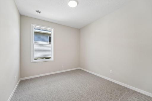 Bedroom 3. Welcome to the Eveleth Patio plan by Robert Thomas Homes. Photos are of similar home; options and features will vary.