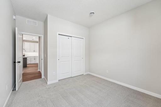 Bedroom 2. Welcome to the Eveleth Patio plan by Robert Thomas Homes. Photos are of similar home; options and features will vary.