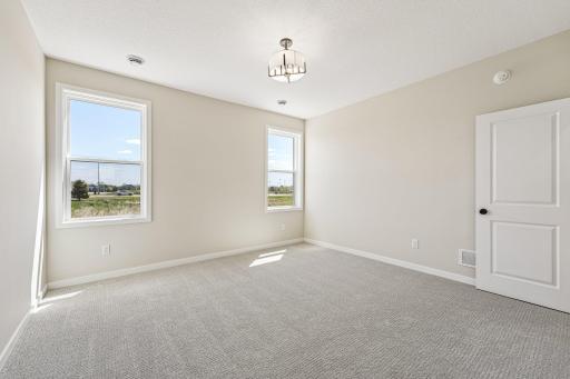 Primary Bedroom. Welcome to the Eveleth Patio plan by Robert Thomas Homes. Photos are of similar home; options and features will vary.