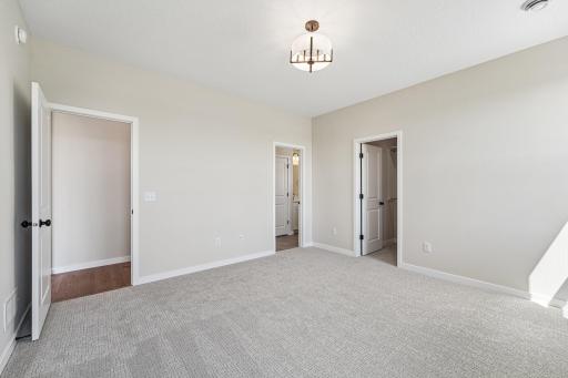 Primary Bedroom. Welcome to the Eveleth Patio plan by Robert Thomas Homes. Photos are of similar home; options and features will vary.