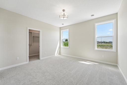 Primary Bedroom. Welcome to the Eveleth Patio plan by Robert Thomas Homes. Photos are of similar home; options and features will vary.