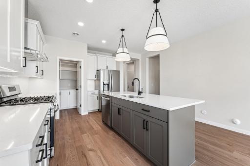 Kitchen. Welcome to the Eveleth Patio plan by Robert Thomas Homes. Photos are of similar home; options and features will vary.