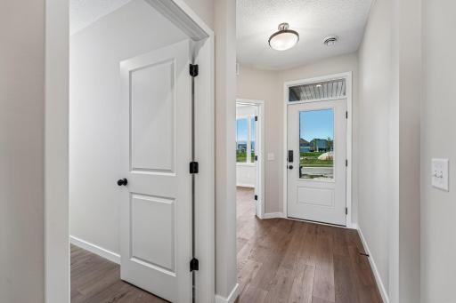 Welcoming foyer with a flex room directly to the left. Photos are of similar home; options and features will vary.