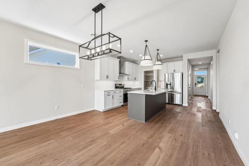 Large Kitchen with an open concept. Photos are of similar home; options and features will vary.