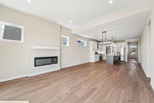 Gathering Room directly off of the Kitchen. Photos are of similar home; options and features will vary.