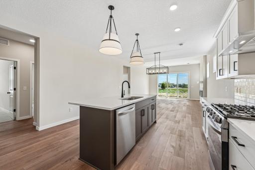 Large Kitchen Island, great for hosting. Photos are of similar home; options and features will vary.
