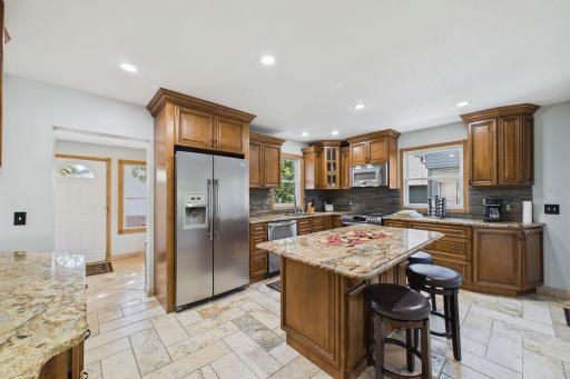 Granite counter tops, center island with eat in opportunities, tons of storage cabinets.