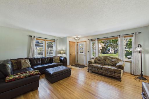 Great living space. Original hardwood flooring and a coat closet.