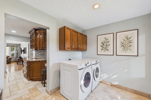 Main level laundry. virtually staged with arts