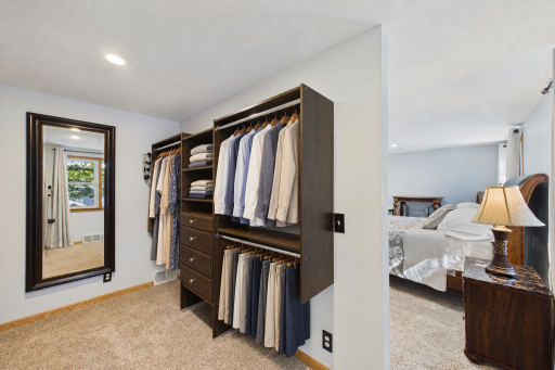 Neatly walk-in closet upper level (virtually staged)