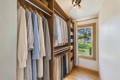 Well organized walk-in closet on main level bedroom #2 (virtually staged)