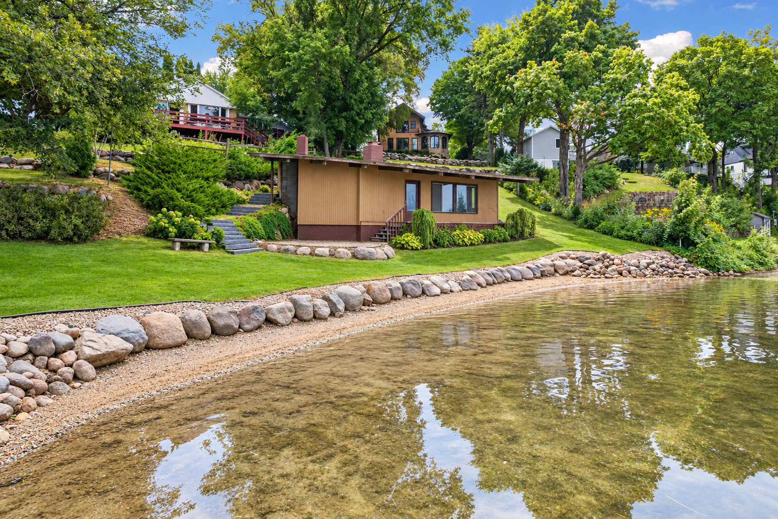 Imagine the possibilities for this one-of-a-kind lakeside boathouse