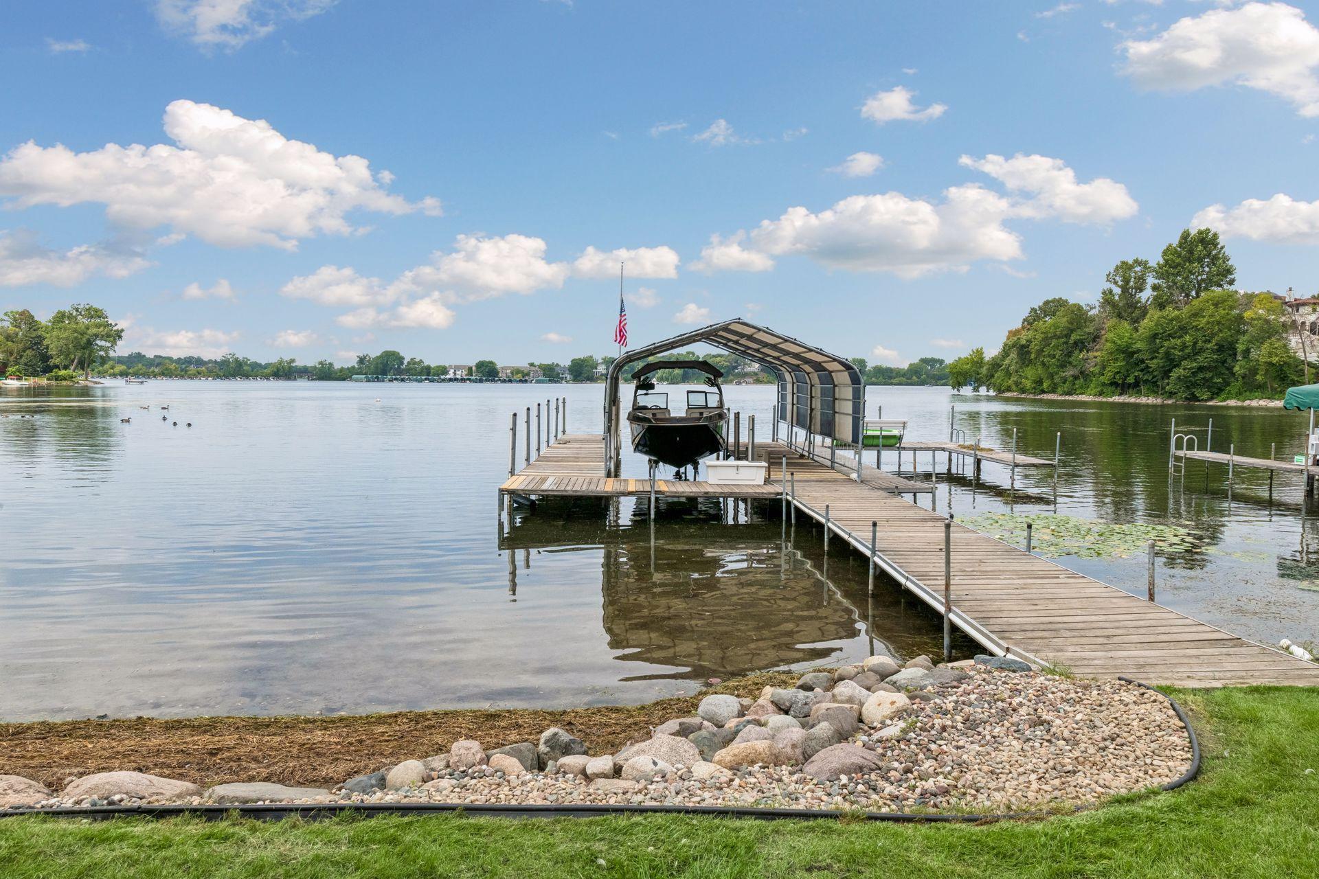 Large dock with covered boat canopy and easy access to St. Albans Bay