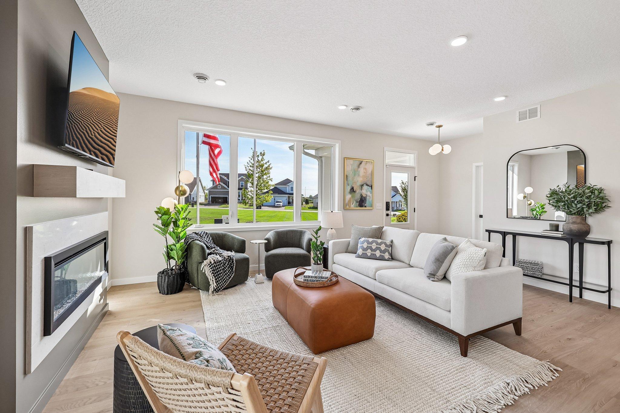 Spacious family room with WOWZA windows!! Photos are from similar home; colors, options and features will vary.