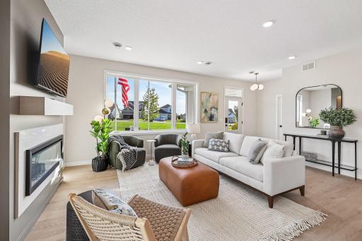 Spacious family room with WOWZA windows!! Photos are from similar home; colors, options and features will vary.