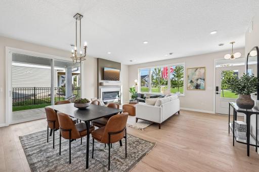 Notice the large patio right off the dining and gathering room. Photos are from similar home; colors, options and features will vary.