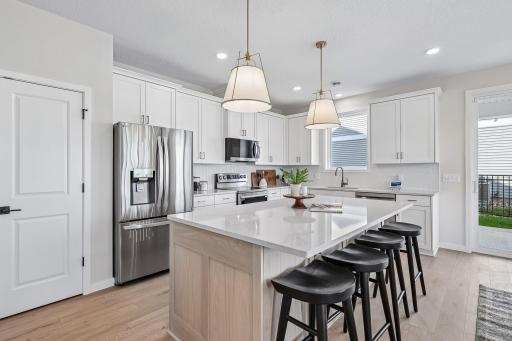 Beautiful kitchen! Photos are from similar home; colors, options and features will vary.