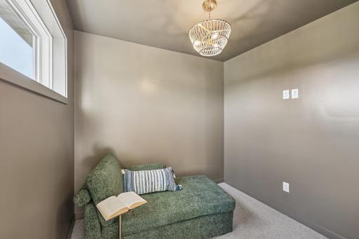 Sitting room off the primary bedroom! Photos are from similar home; colors, options and features will vary.