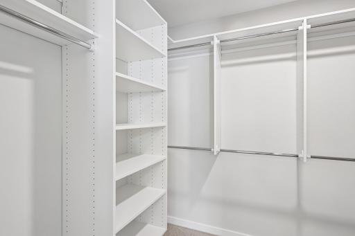 Primary closet shelving system. Photos are from similar home; colors, options and features will vary.